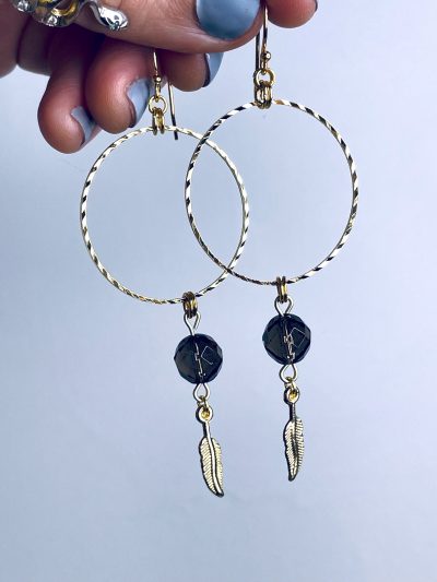 ‘B**** Don’t Kill My Vibe’ Smoky Quartz Gold Plated Stainless Steel Hoops with Feather Charms